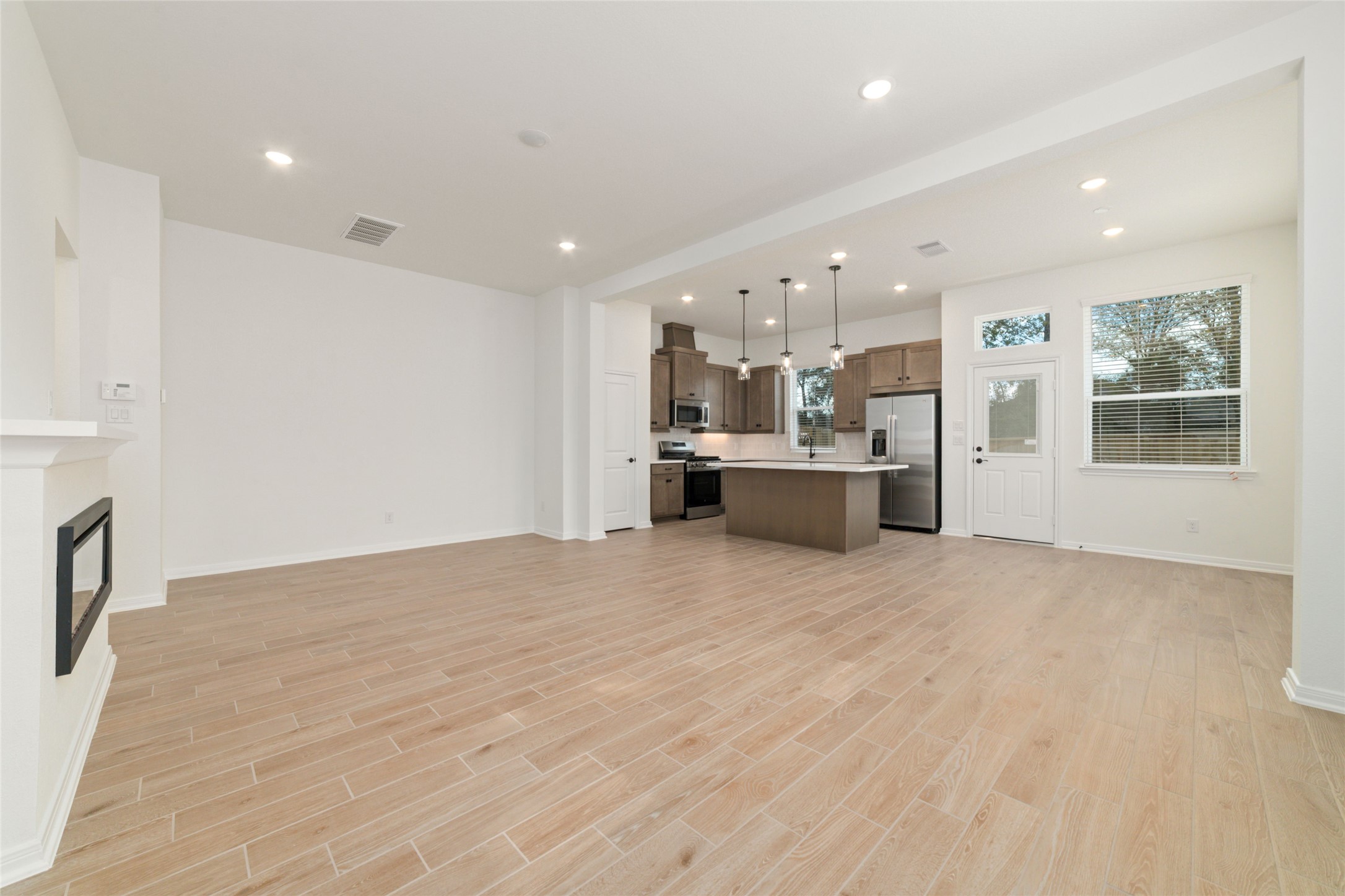 135 East Coralburst Loop, Unit 1 Montgomery, TX 77316 - Photo 5 of 22 a view of a kitchen with a sink and a window