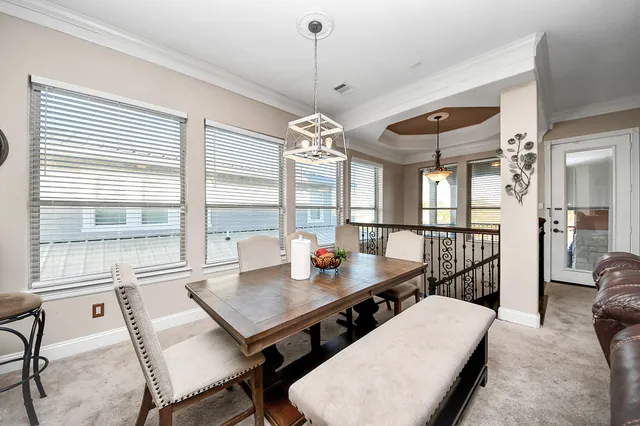 a kitchen with stainless steel appliances granite countertop a sink a stove and a wooden floors