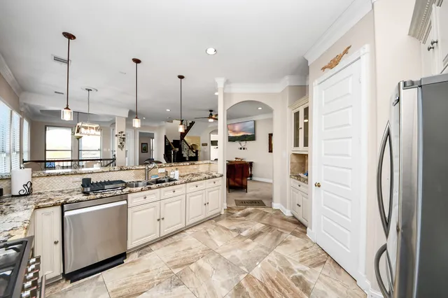 a view of a livingroom with wooden floor and windows