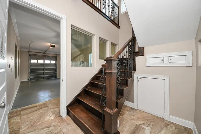 a living room with a bed furniture and a window