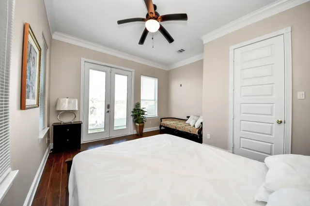 a bathroom with a granite countertop sink a toilet and shower