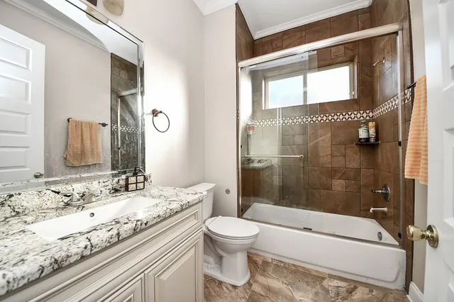 a view of a room with entryway furniture and floor to ceiling window