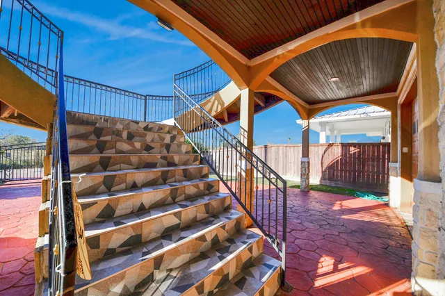 a view of a balcony with staircase