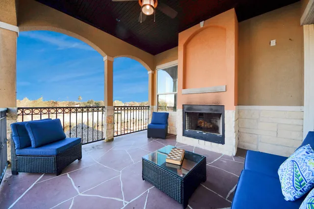a view of a room with wooden floor and windows