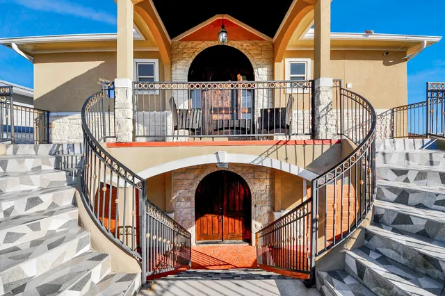 a view of balcony with furniture