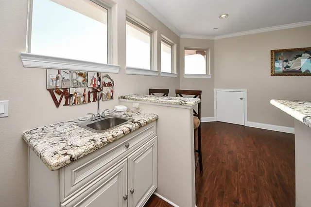 a view of a patio with dining table and chairs