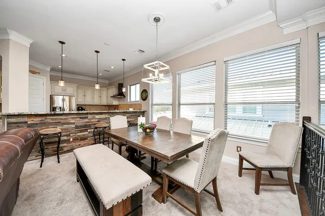 a kitchen with stainless steel appliances granite countertop a refrigerator and a stove