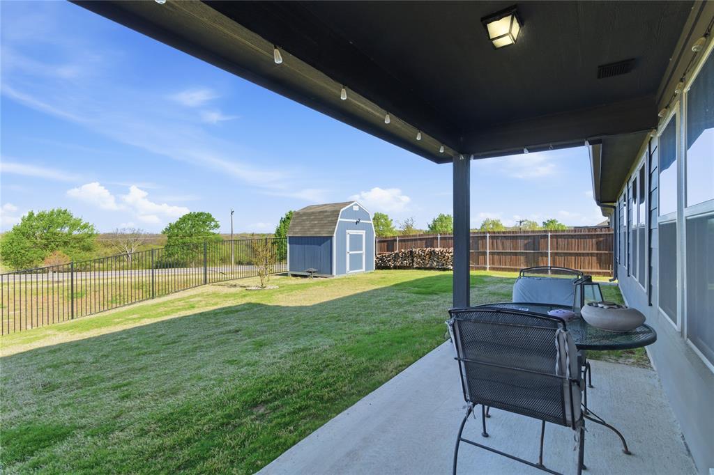 748 Ruellia Street Weatherford, TX 76086 - Photo 28 of 37 a swimming pool with outdoor seating and garden