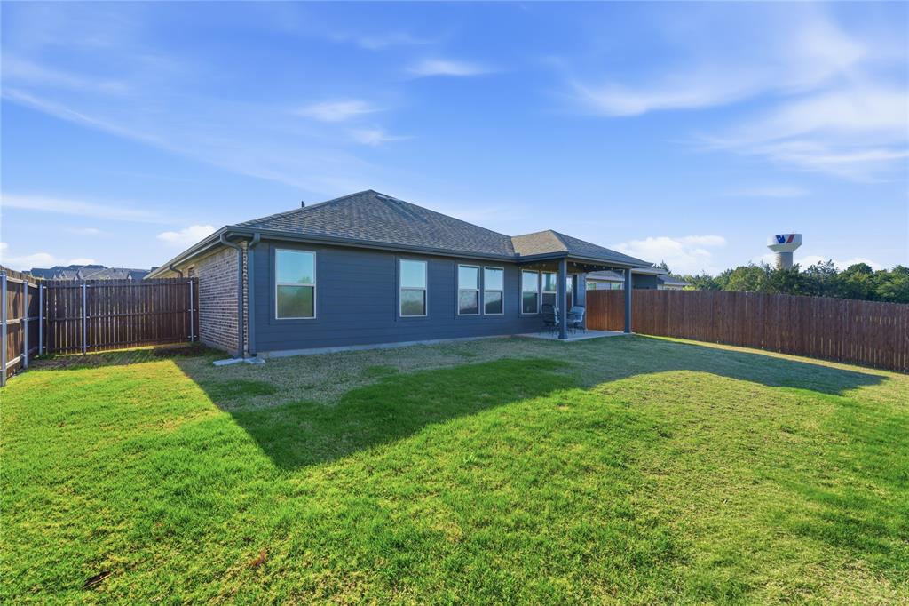 748 Ruellia Street Weatherford, TX 76086 - Photo 31 of 37 a backyard of a house with lots of green space