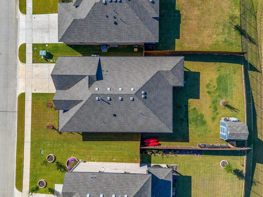 748 Ruellia Street Weatherford, TX 76086 - Photo 35 of 37 an aerial view of a house with a yard