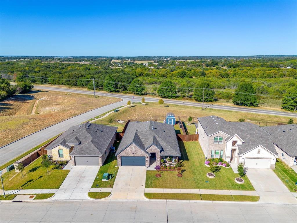 748 Ruellia Street Weatherford, TX 76086 - Photo 36 of 37 swimming pool view with a lake view