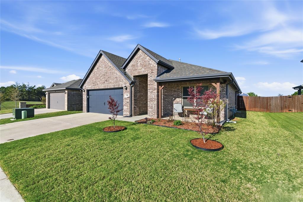 748 Ruellia Street Weatherford, TX 76086 - Photo 7 of 37 a view of a house with backyard and porch