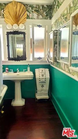 a room with pool table and windows