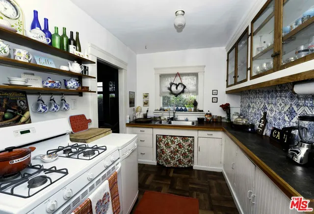 a kitchen with a stove and a sink