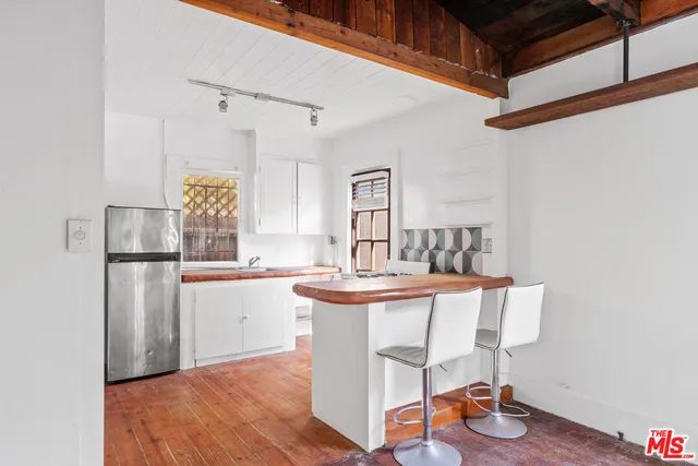 a dining room with a table and chairs