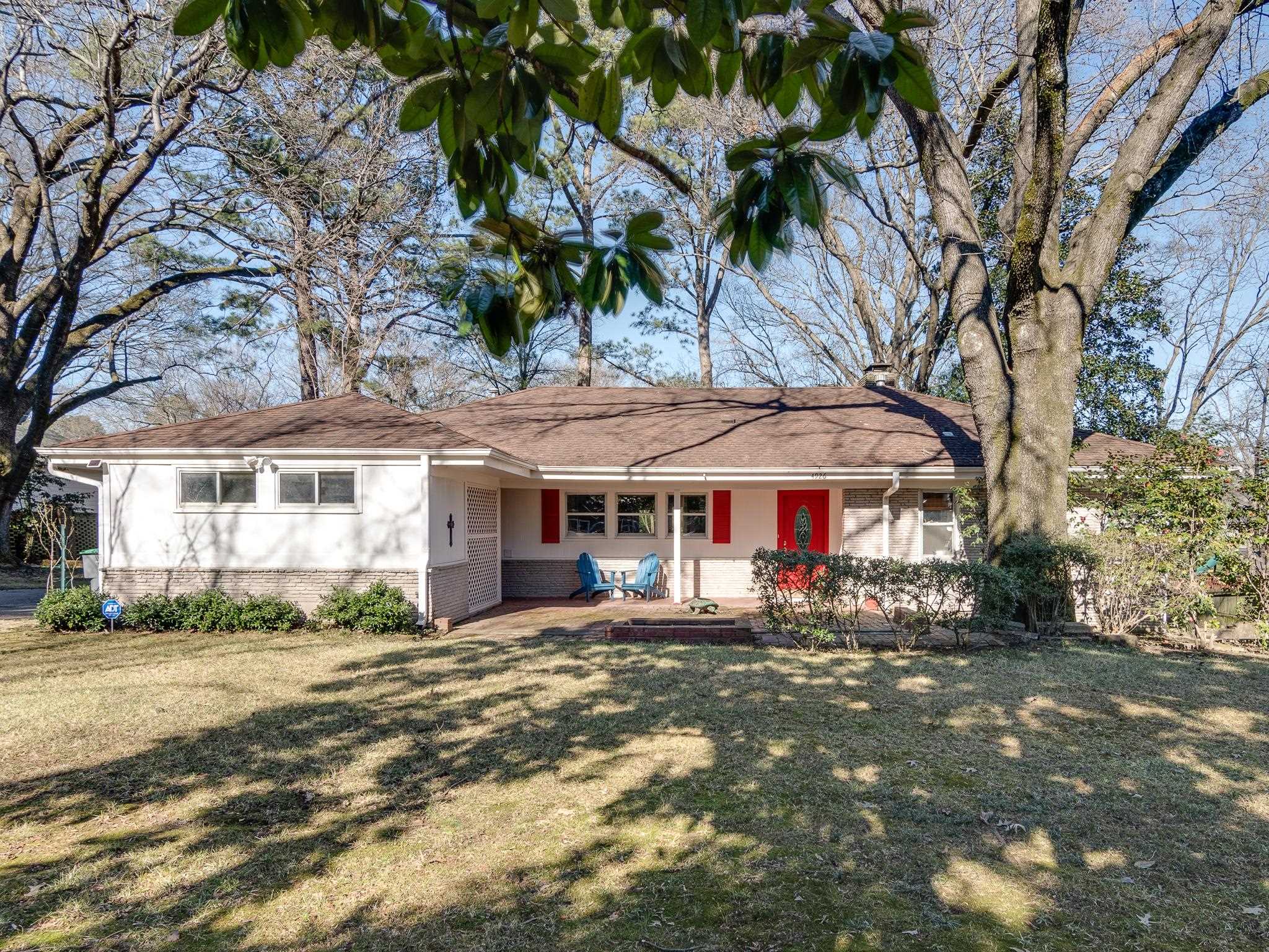 4926 Shady Grove Road Memphis, TN 38117 - Photo 1 of 23 a front view of a building with large trees