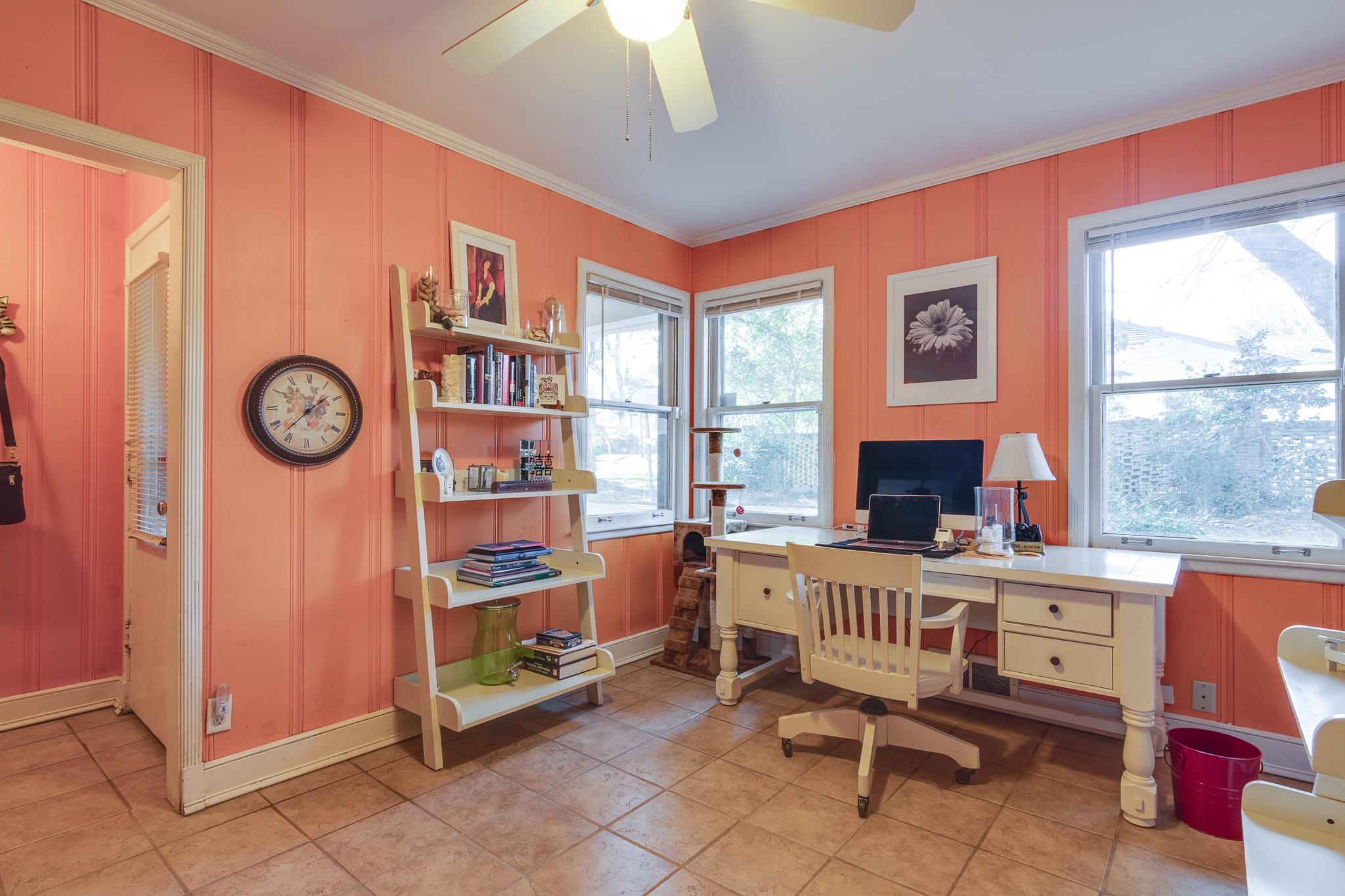 4926 Shady Grove Road Memphis, TN 38117 - Photo 11 of 23 a room with furniture a clock and a window