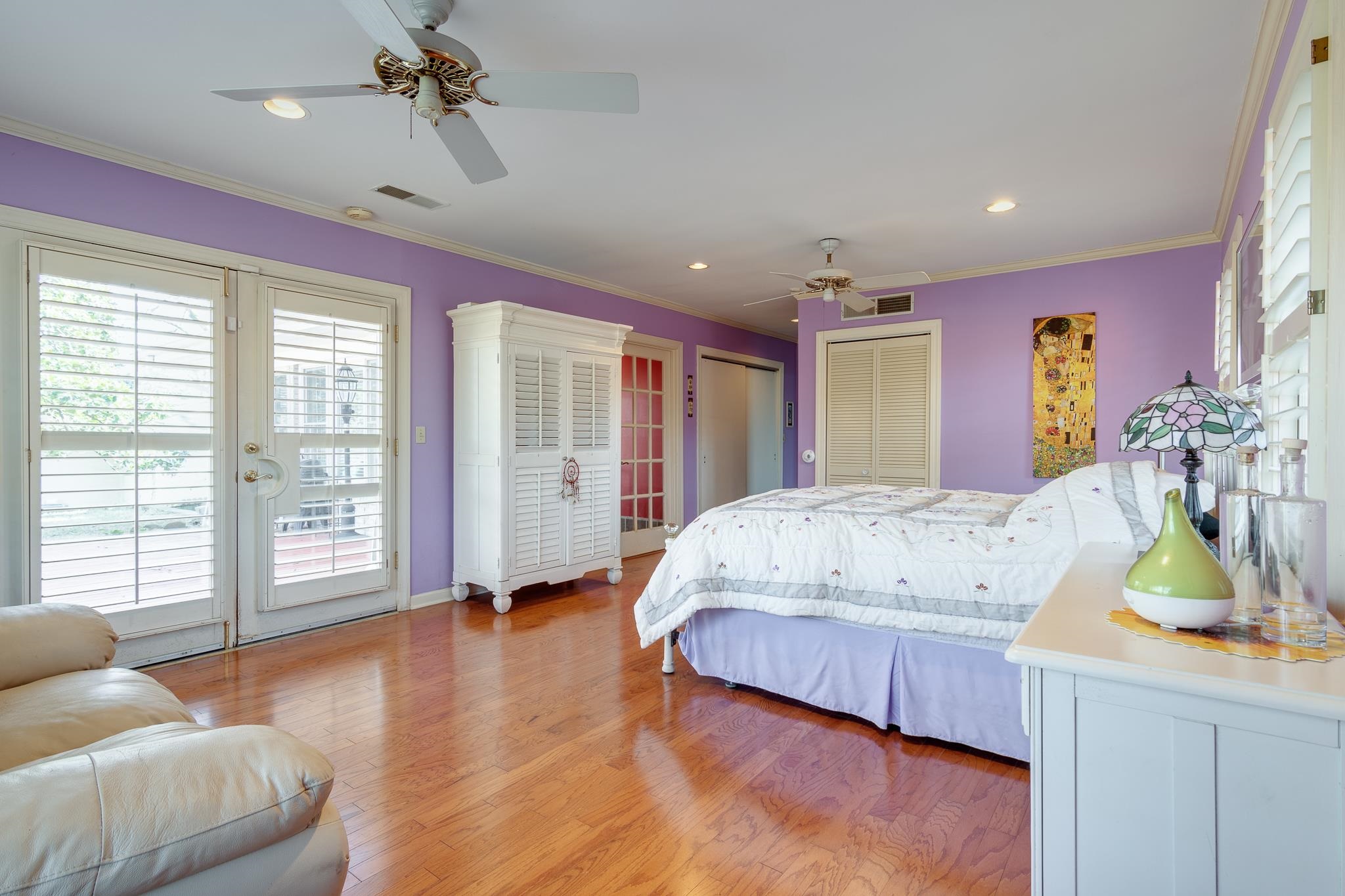 4926 Shady Grove Road Memphis, TN 38117 - Photo 13 of 23 a spacious bedroom with a bed a chandelier and a large window