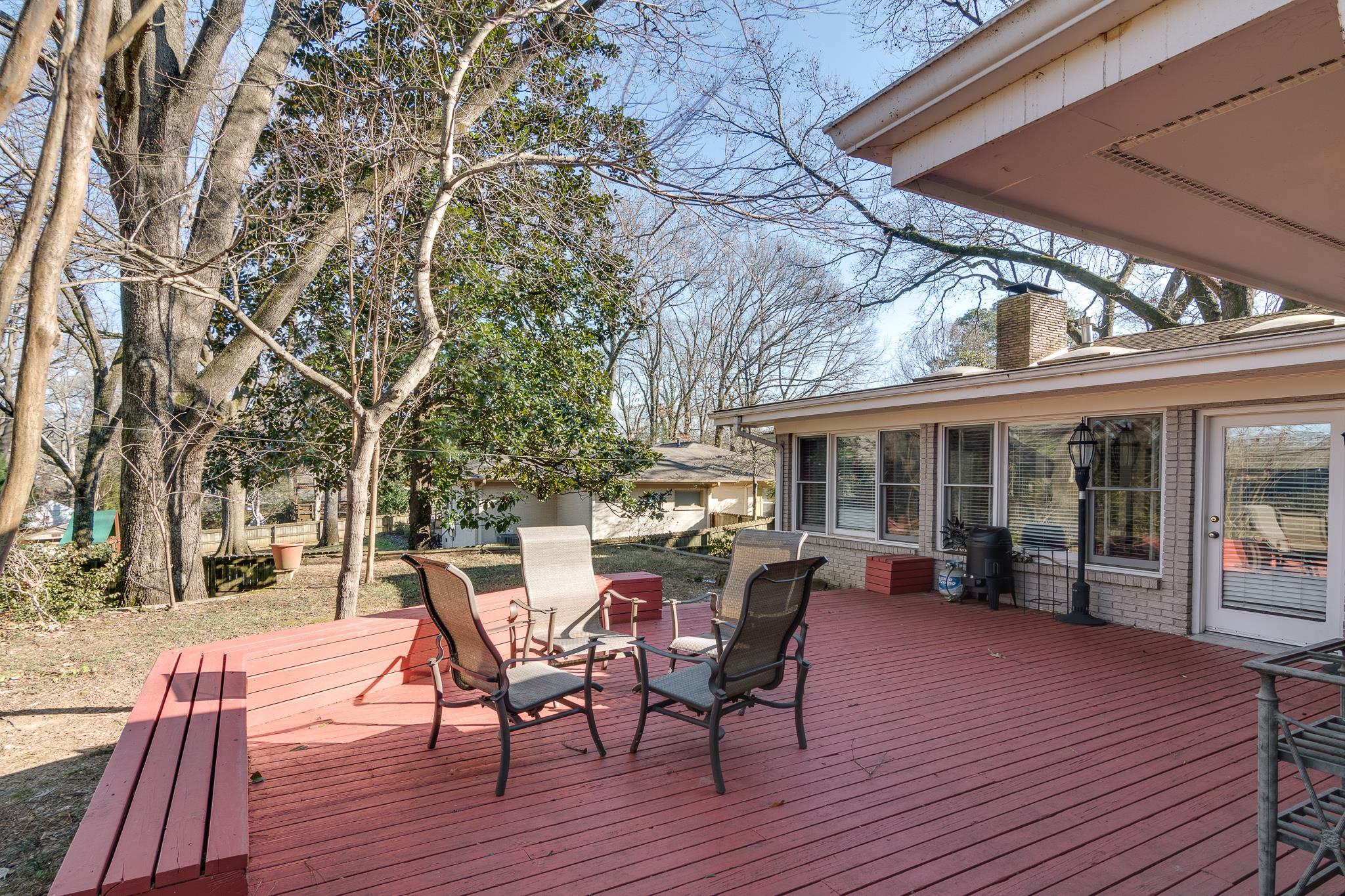 4926 Shady Grove Road Memphis, TN 38117 - Photo 22 of 23 a view of a patio with table and chairs and wooden floor