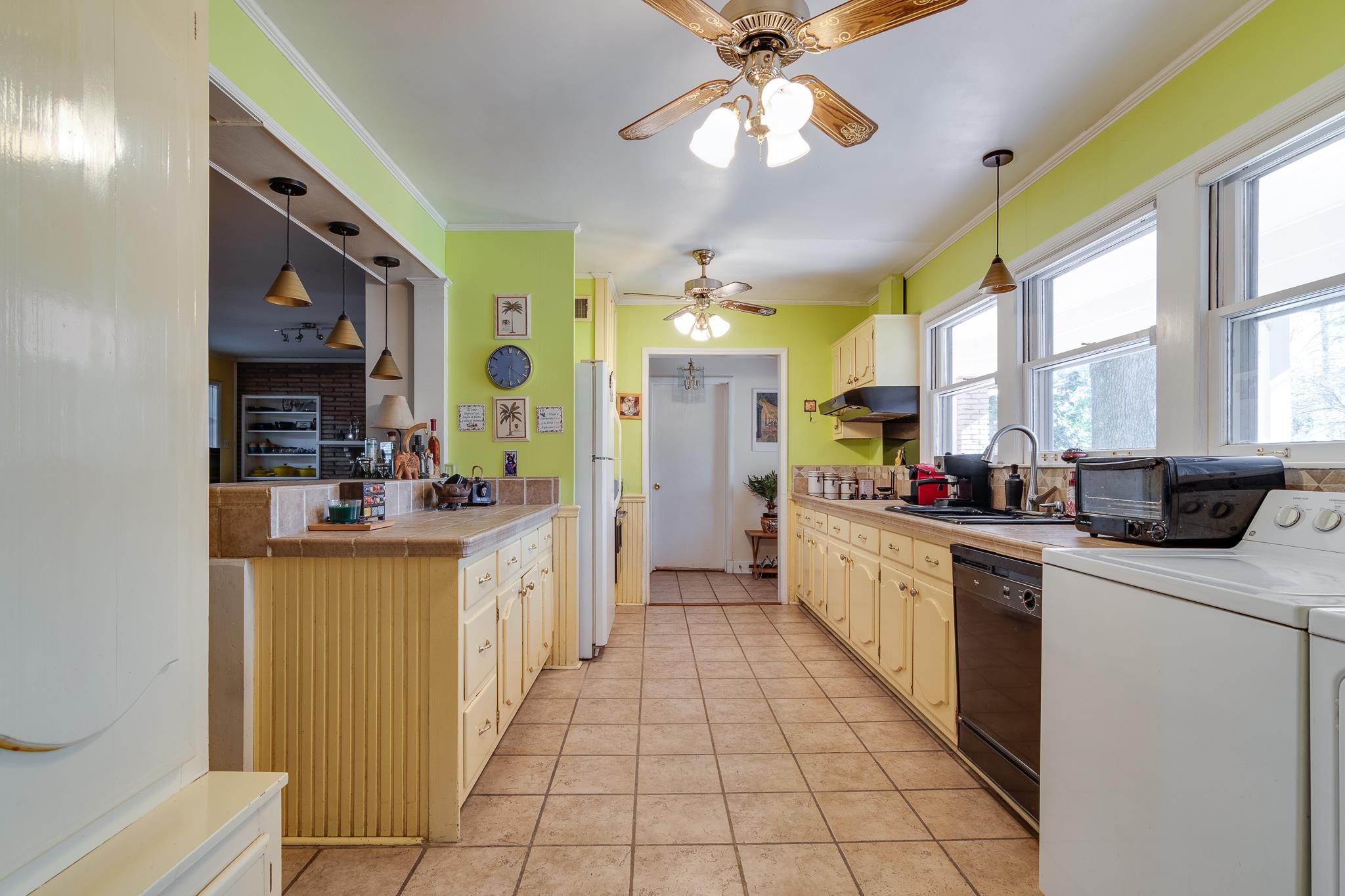 4926 Shady Grove Road Memphis, TN 38117 - Photo 10 of 23 a large kitchen with stainless steel appliances granite countertop a large stove a sink dishwasher and a refrigerator