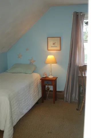 a utility room with cabinets washer and dryer