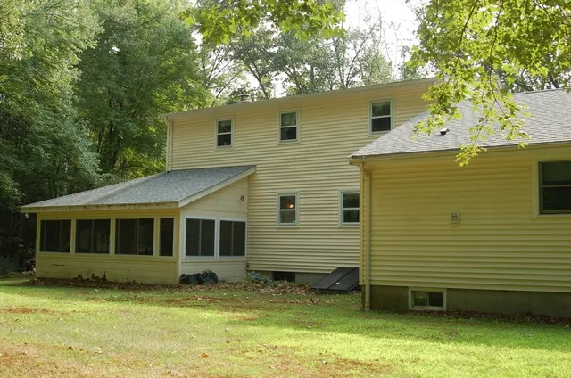 a view of a house with a yard