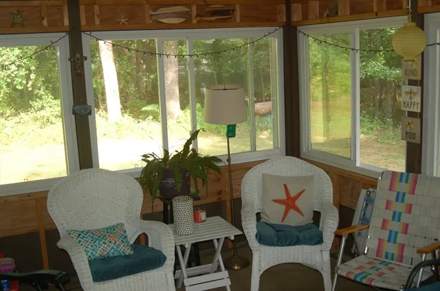 a living room with furniture and a window