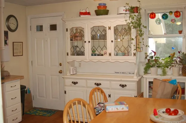 a living room with furniture window and a fireplace