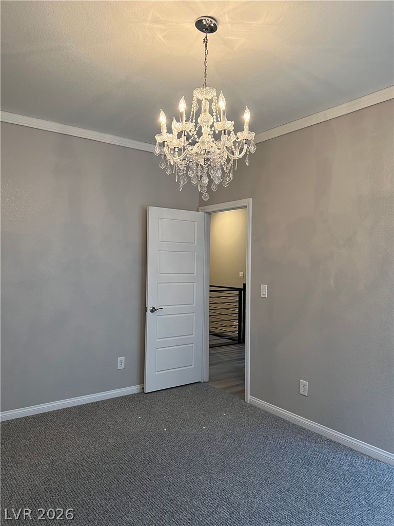 5981 Honeysuckle Ridge Street Las Vegas, NV 89148 - Photo 22 of 29 A radiant crystal chandelier illuminates this flexible space, perfect for various uses.