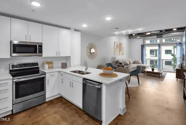 a kitchen with a stove and a microwave