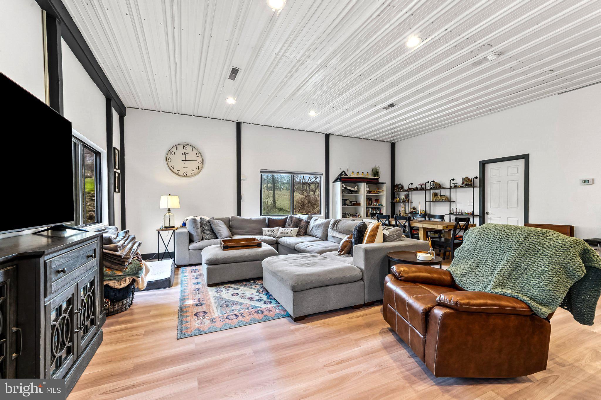928 Stargazer Road Coatesville, PA 19320 - Photo 12 of 22 a living room with furniture and a flat screen tv