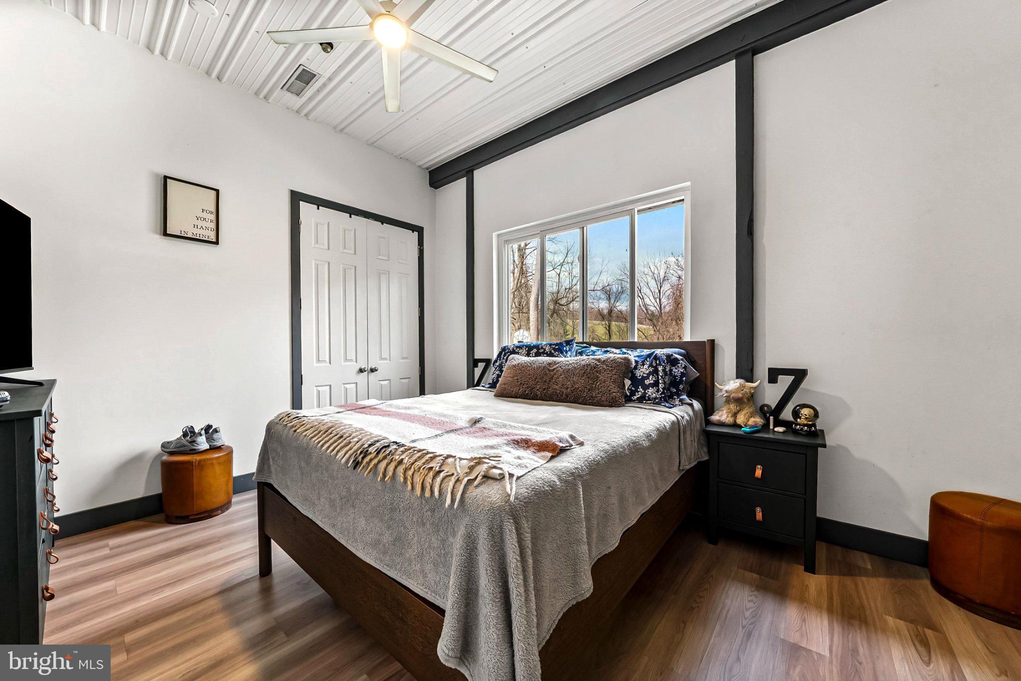 928 Stargazer Road Coatesville, PA 19320 - Photo 14 of 22 a bedroom with a bed and wooden floor