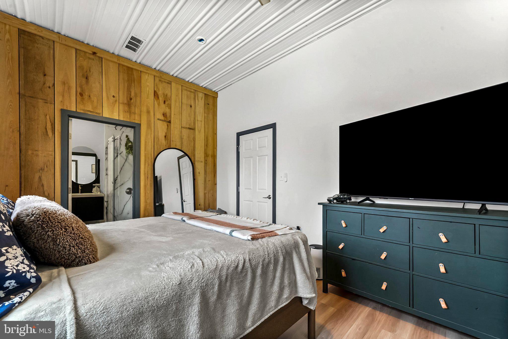 928 Stargazer Road Coatesville, PA 19320 - Photo 15 of 22 a bedroom with a bed and a flat screen tv