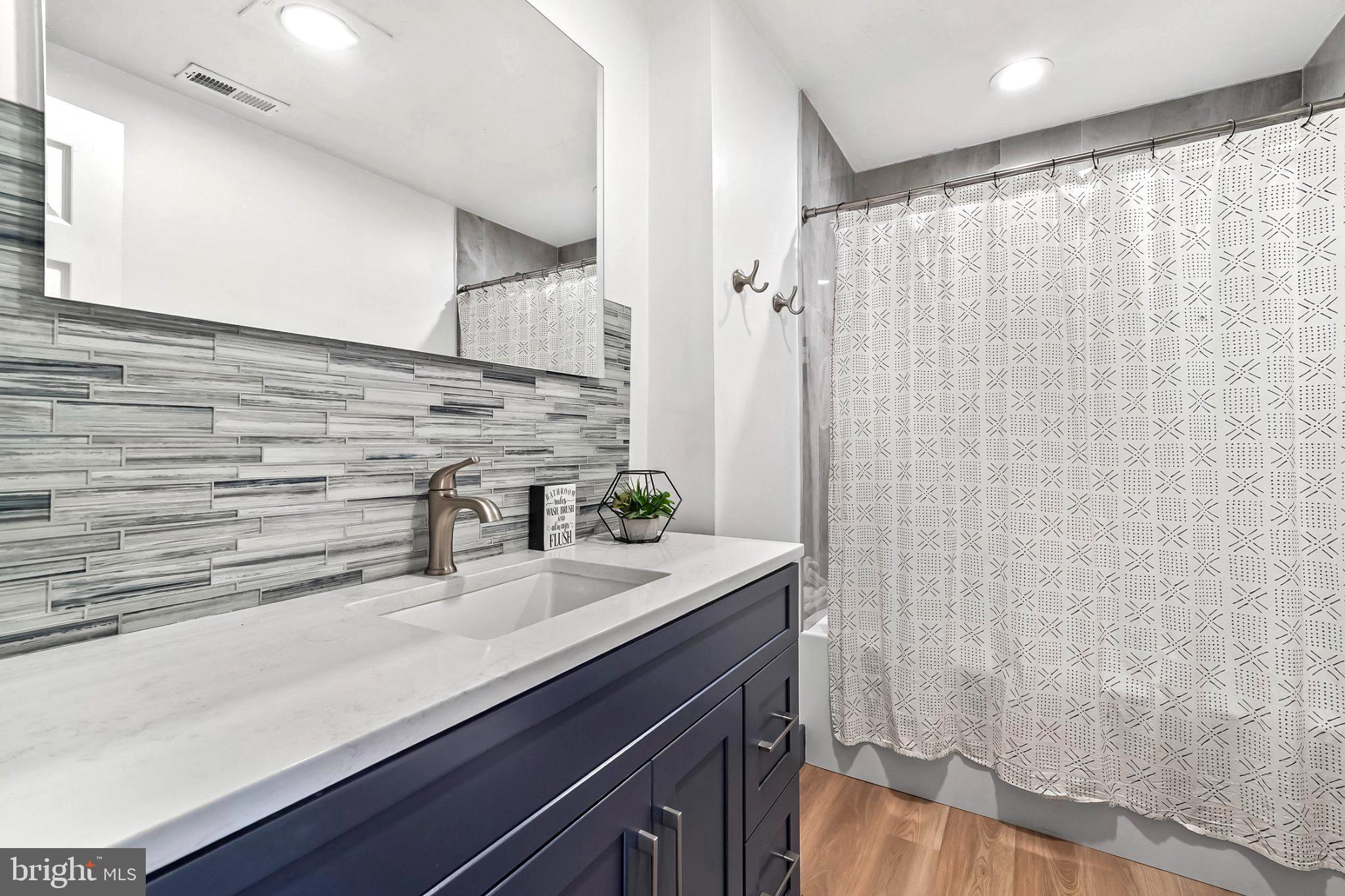 928 Stargazer Road Coatesville, PA 19320 - Photo 18 of 22 a bathroom with a sink a vanity and a shower