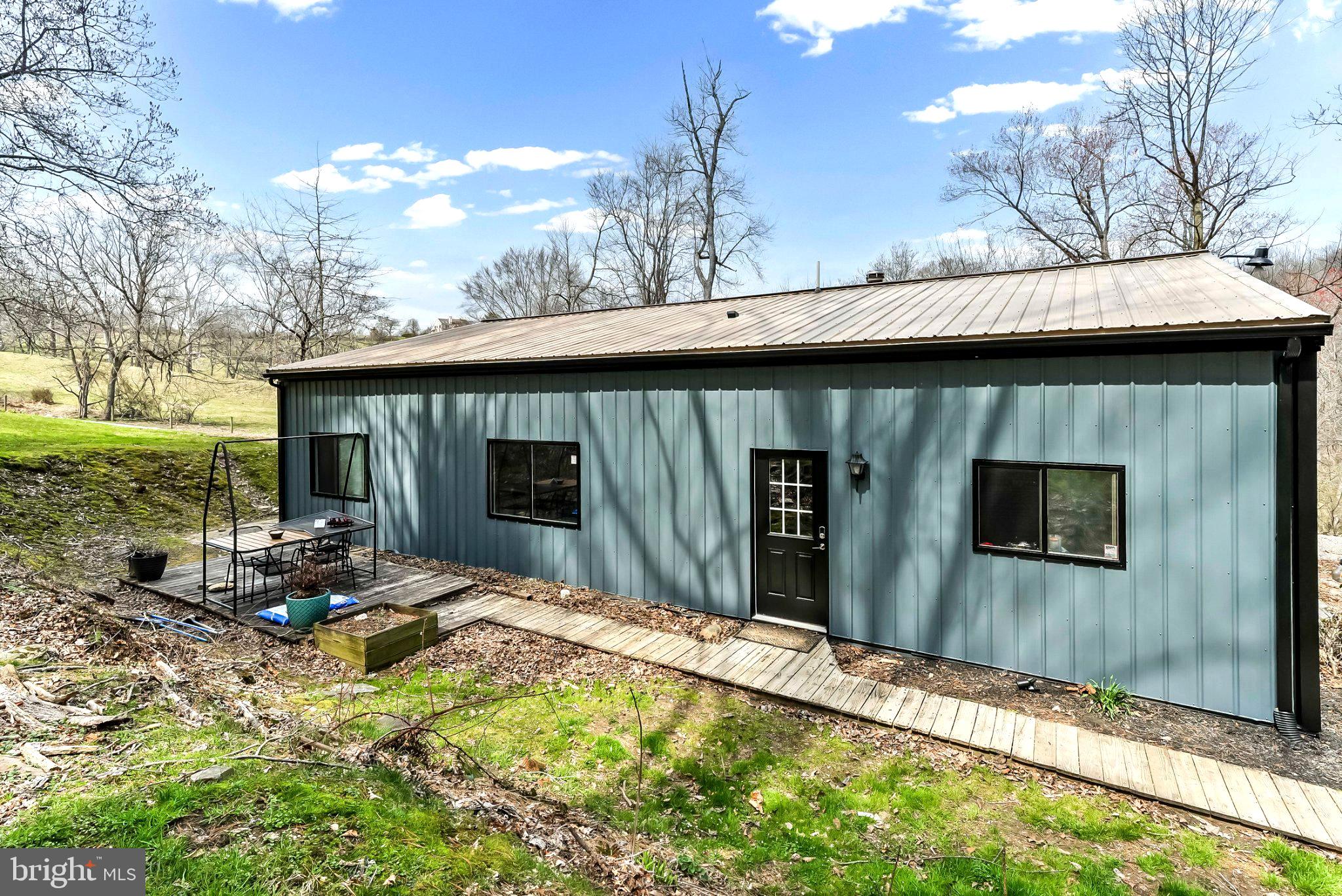 928 Stargazer Road Coatesville, PA 19320 - Photo 9 of 22 a backyard of a house with table and chairs