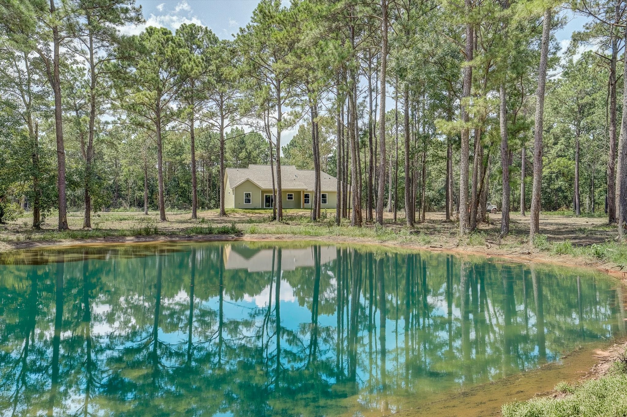 242 Private Road Liberty, TX 77575 - Photo 2 of 40 Back yard w/ pond