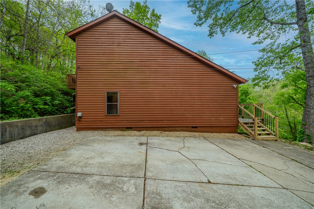 10584 New Biddinger Road Harrison, OH 45030 - Photo 39 of 61 This property features durable wood siding and an inviting concrete driveway.