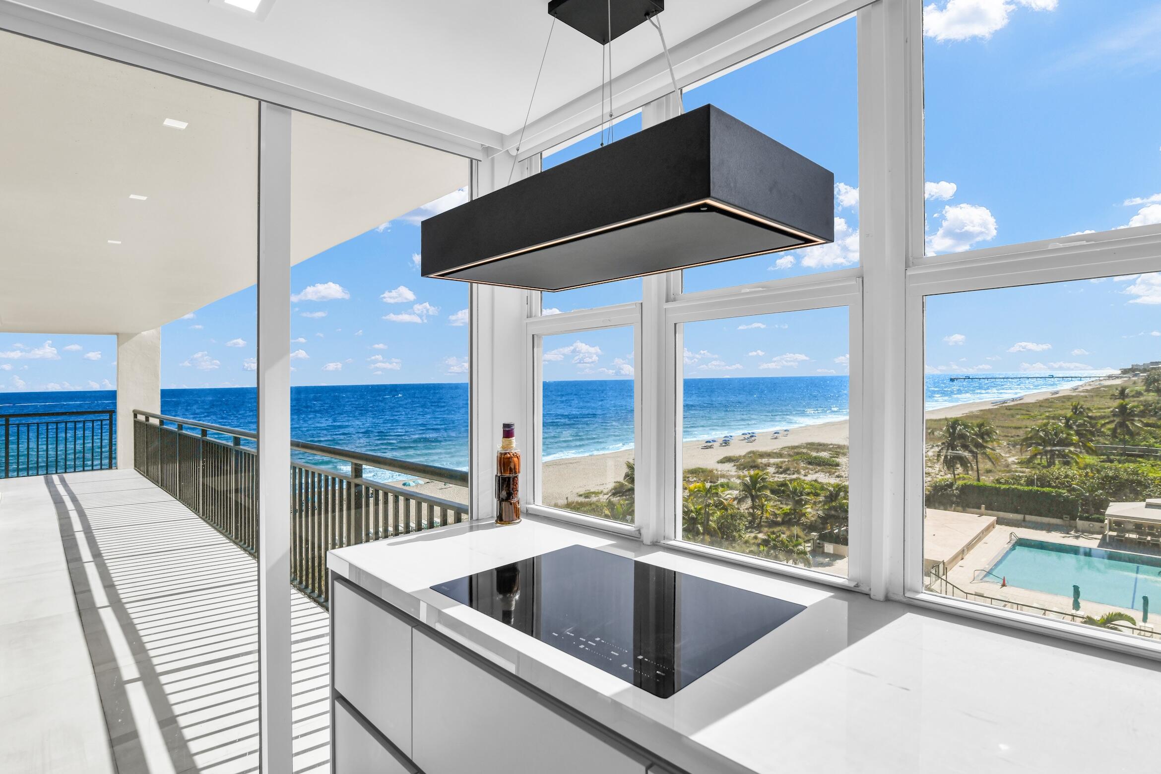 2000 South Ocean Boulevard, Unit 6K Boca Raton, FL 33432 - Photo 17 of 94 a kitchen with a large window and sink