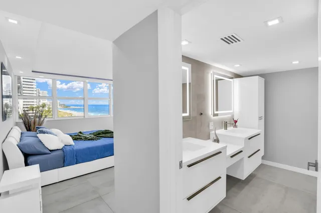 a bathroom with a shower and a glass door