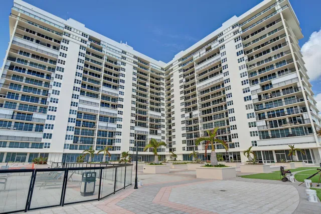a view of a living room and kitchen with furniture