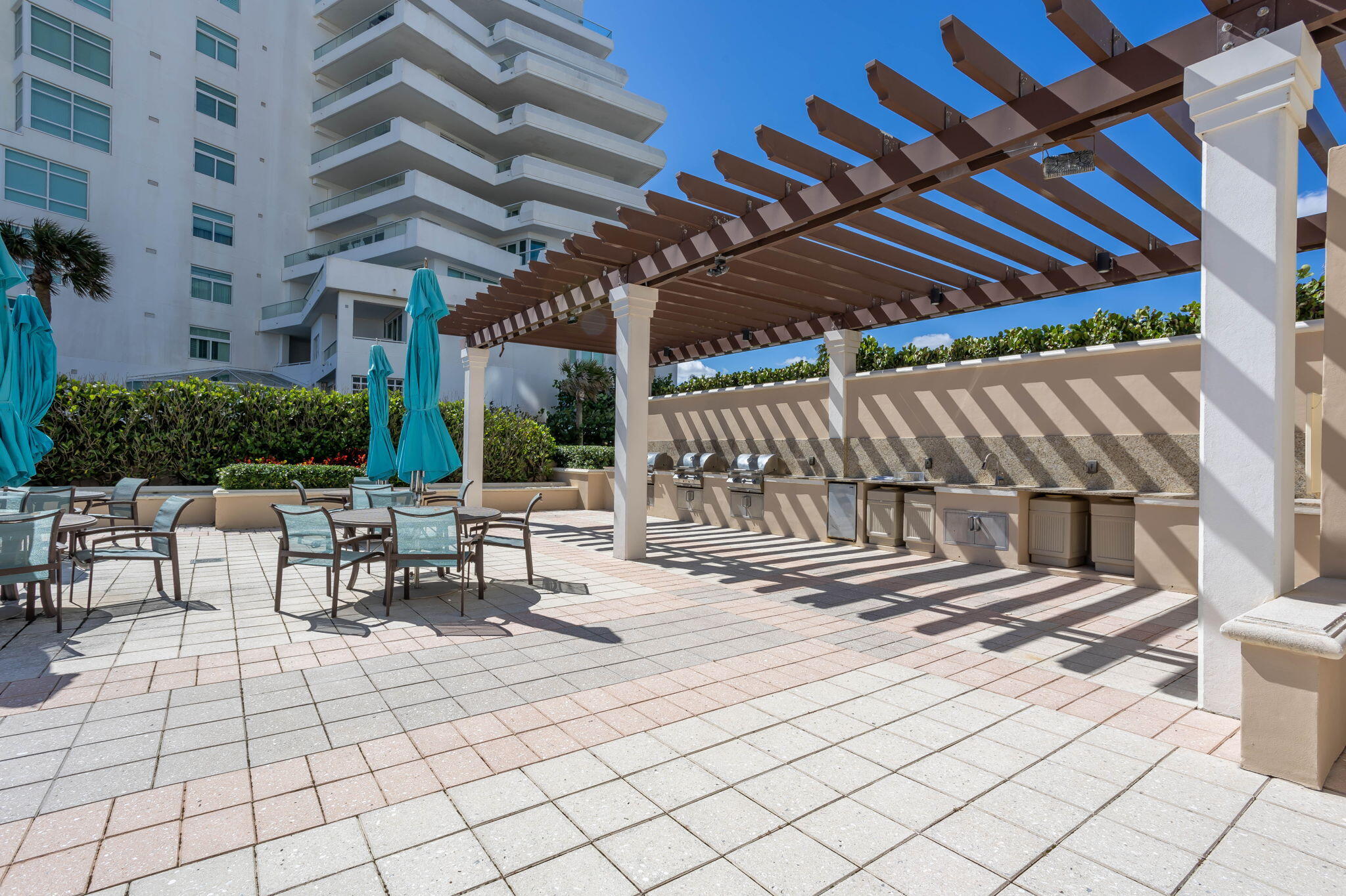 2000 South Ocean Boulevard, Unit 6K Boca Raton, FL 33432 - Photo 68 of 94 a view of patio with a table and chairs