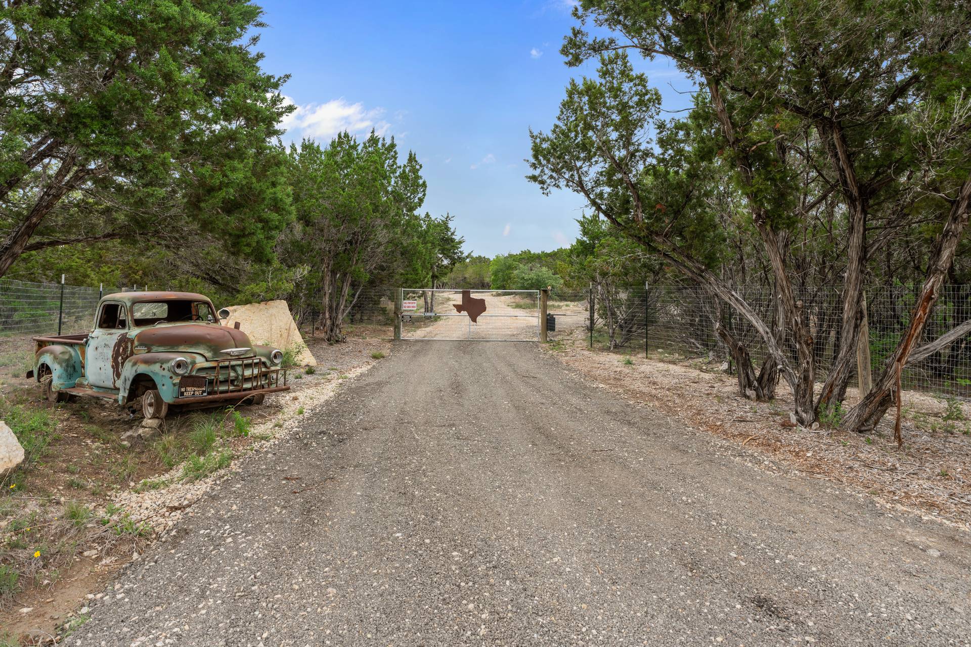 a view of a road with car parked