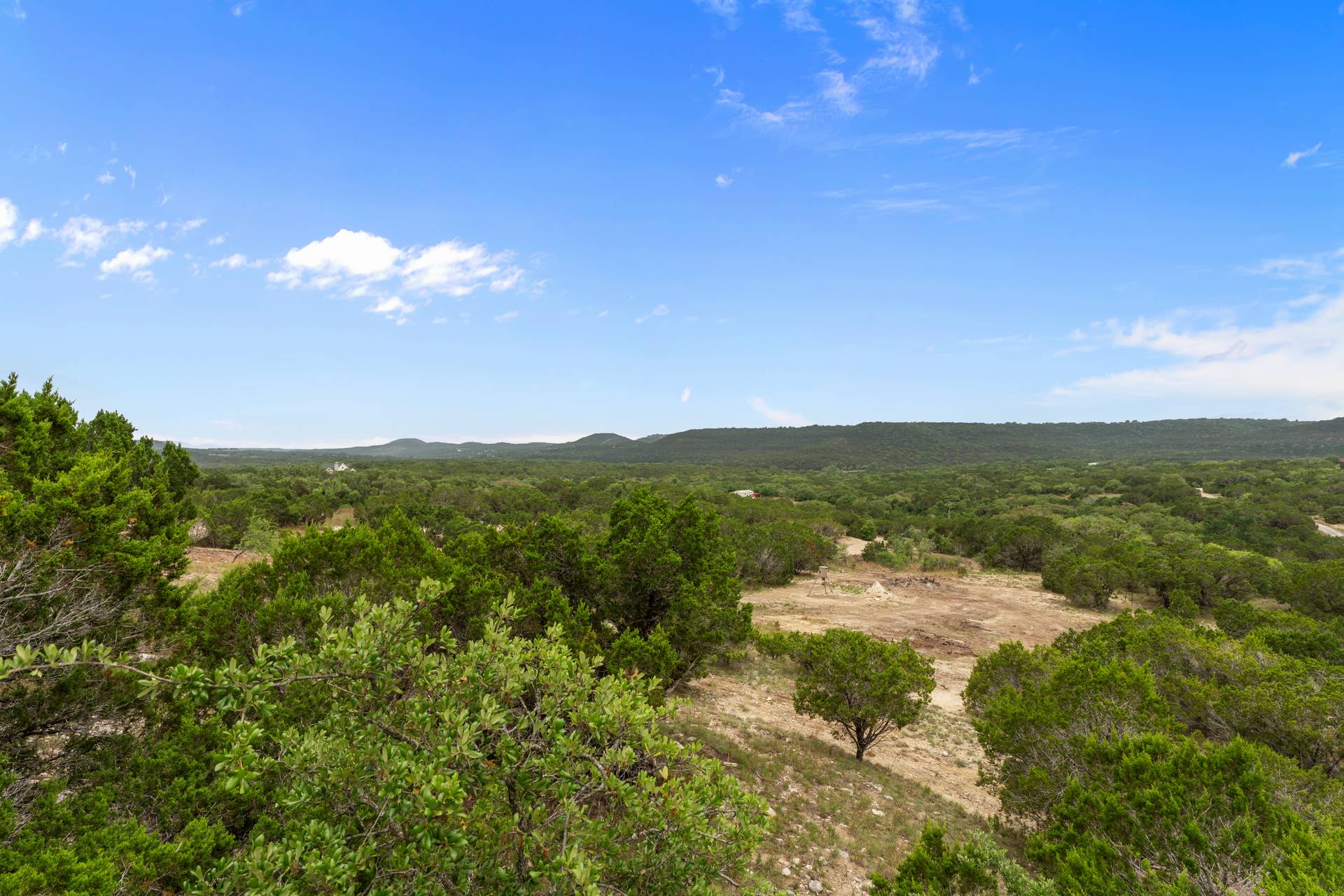 182 Quail Creek Road Marble Falls, TX 78654 - Photo 13 of 20 a view of a lake with mountains in the background