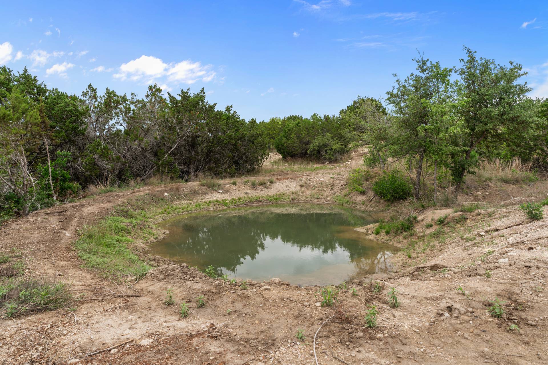 182 Quail Creek Road Marble Falls, TX 78654 - Photo 19 of 20 a view of a lake from a yard