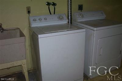 2329 Caladium Road Fort Myers, FL 33905 - Photo 6 of 7 a utility room with dryer and washer
