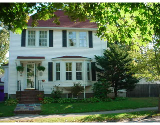94 Reservation Road Milton, MA 02186 - Photo 1 of 9 a view of a brick house with a yard