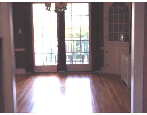 94 Reservation Road Milton, MA 02186 - Photo 5 of 9 a view of a livingroom with wooden floor and windows