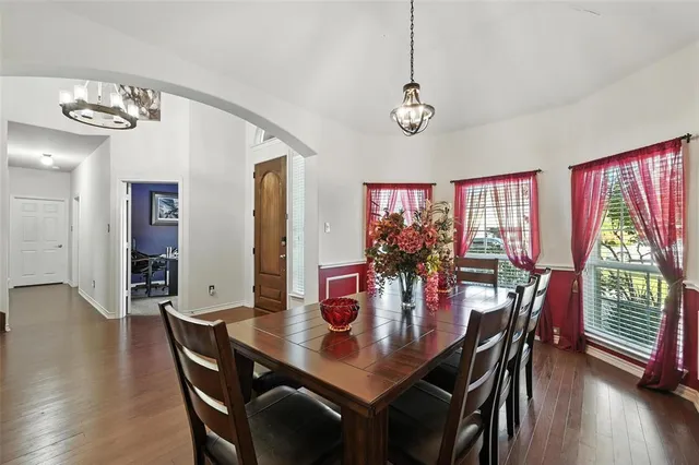 a view of a dining room with furniture window and wooden floor