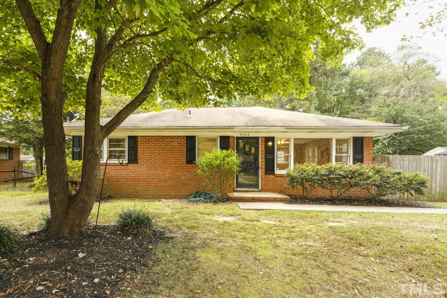 4008 Cheek Road Durham, NC 27704 - Photo 1 of 10 a front view of house with yard and green space
