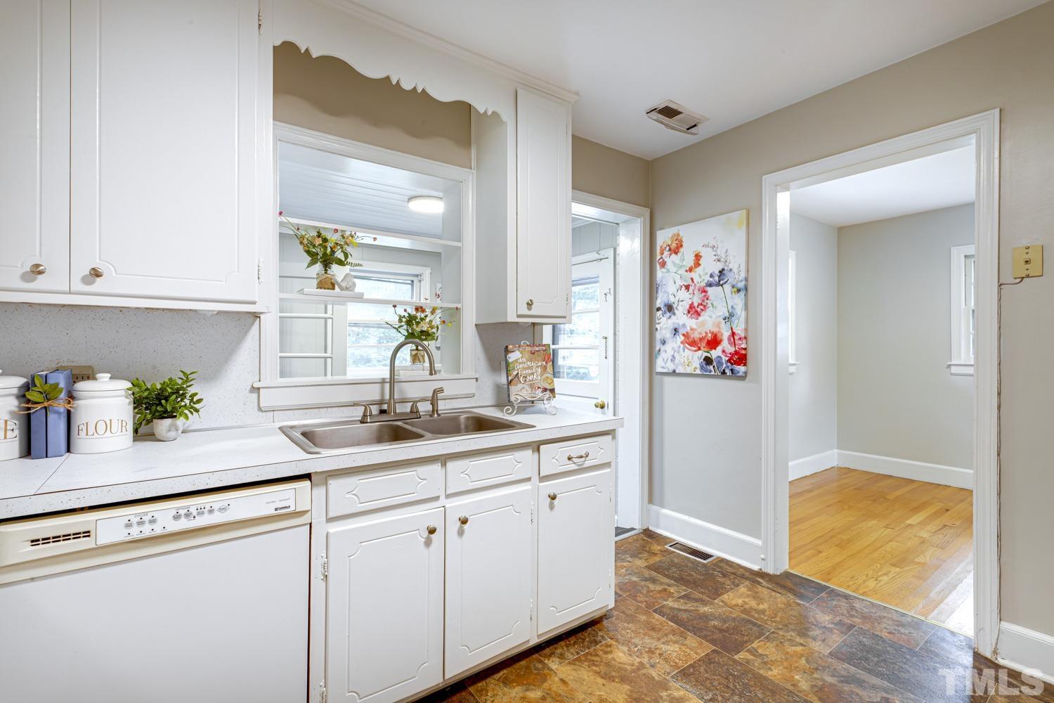 4008 Cheek Road Durham, NC 27704 - Photo 6 of 10 a kitchen with sink and cabinets
